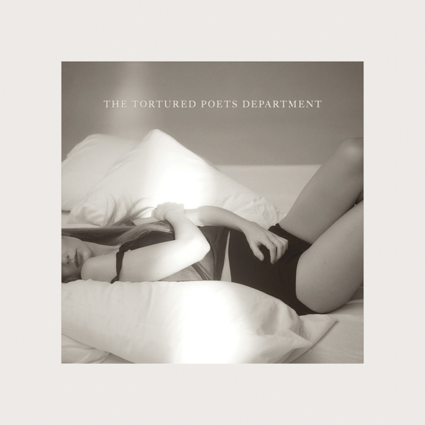 Album cover showing person lying on bed, titled "The Tortured Poets Department"